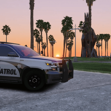 A car silhouette against a sunset